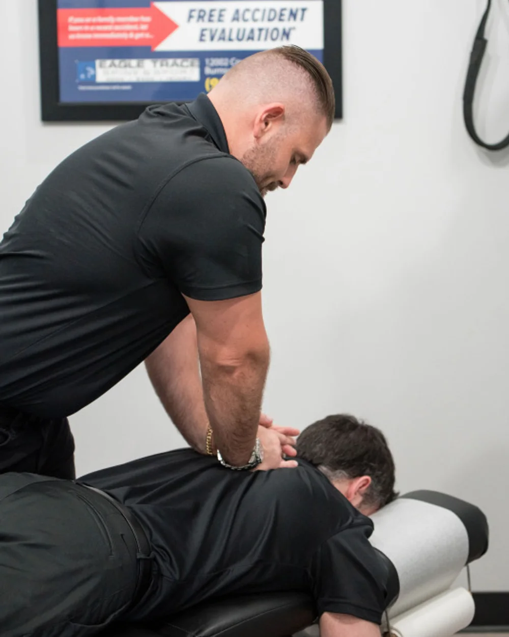 Dr. Jeff Plaster evaluating a work-injury patient at Eagle Trace Spine & Sport in Burnsville